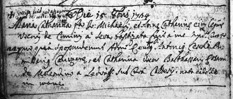 1734. Baptism of Maria Cattarina Comini a Sera, with note about her murder in upper left corner.